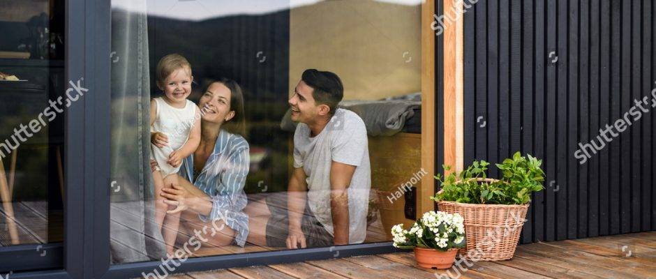 stock-photo-young-family-with-small-daughter-indoors-weekend-away-in-container-house-in-countryside-1801887694